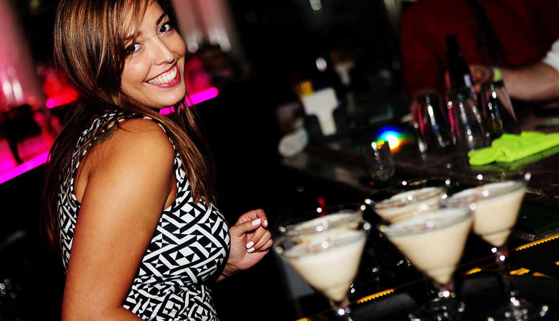 Smiling Bartender Serving Drinks At Night Clubs, Baton Rouge, LA Photo - The Penthouse Club